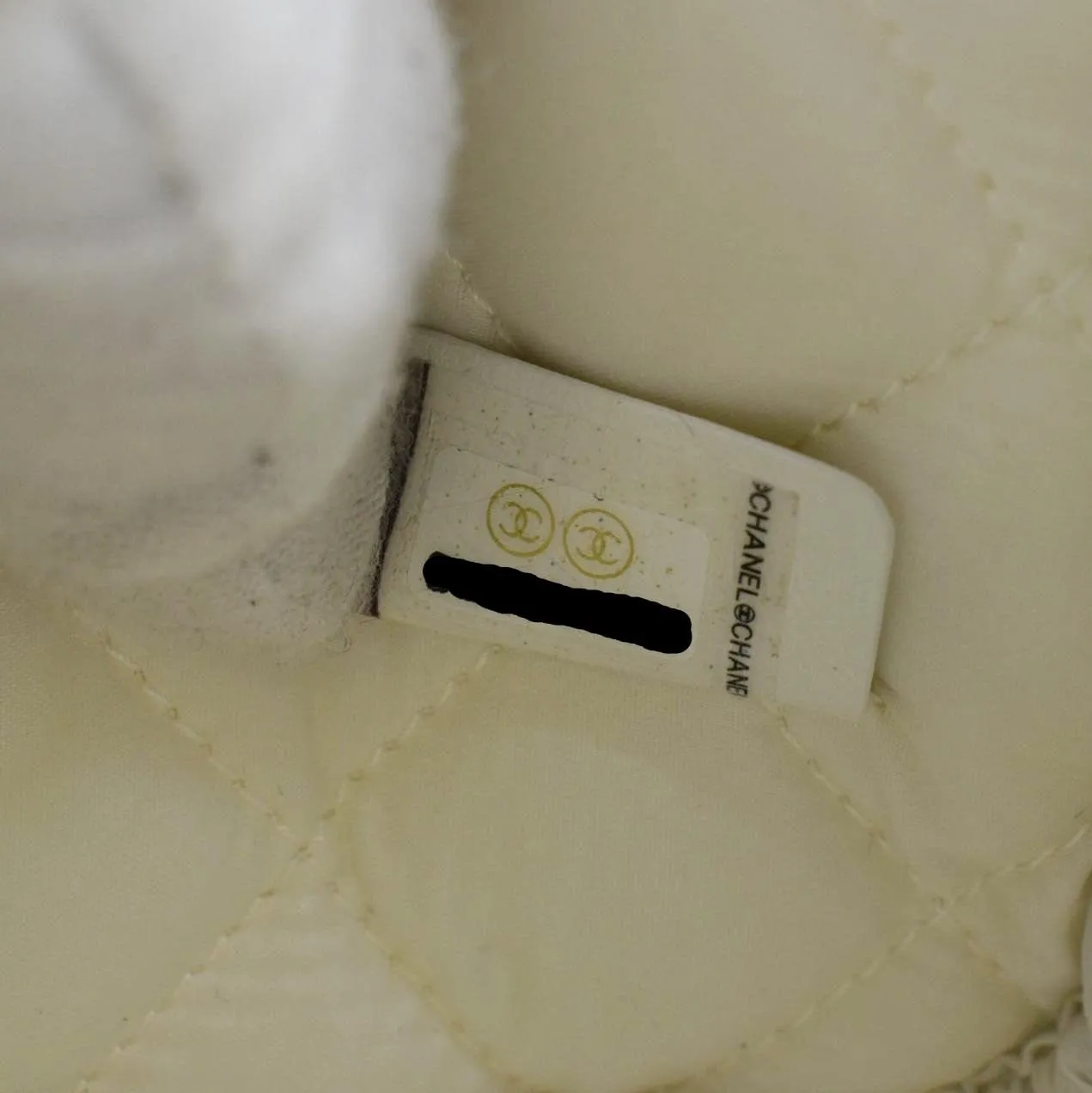CHANEL Curvy Small Quilted Caviar Leather Cosmetic Pouch White